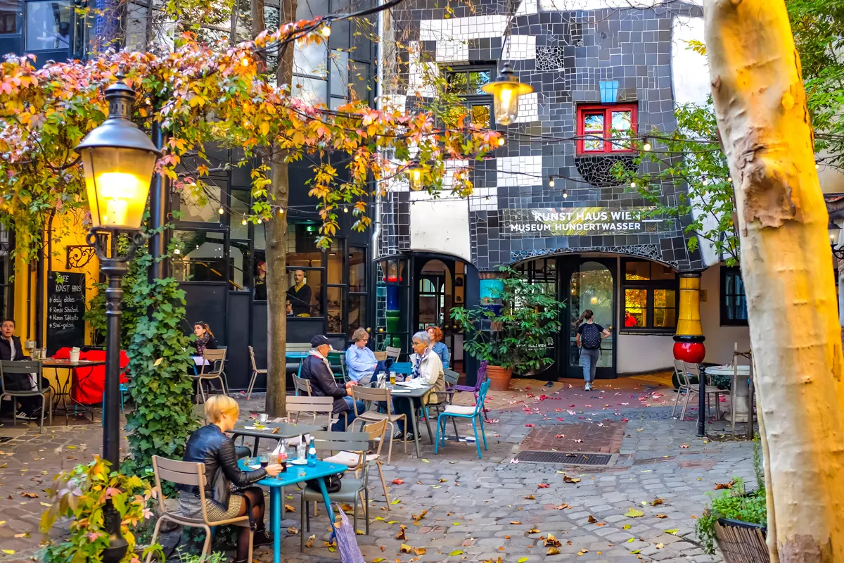 Hundertwasser Museum Vienna courtyard with trees and outdoor seating