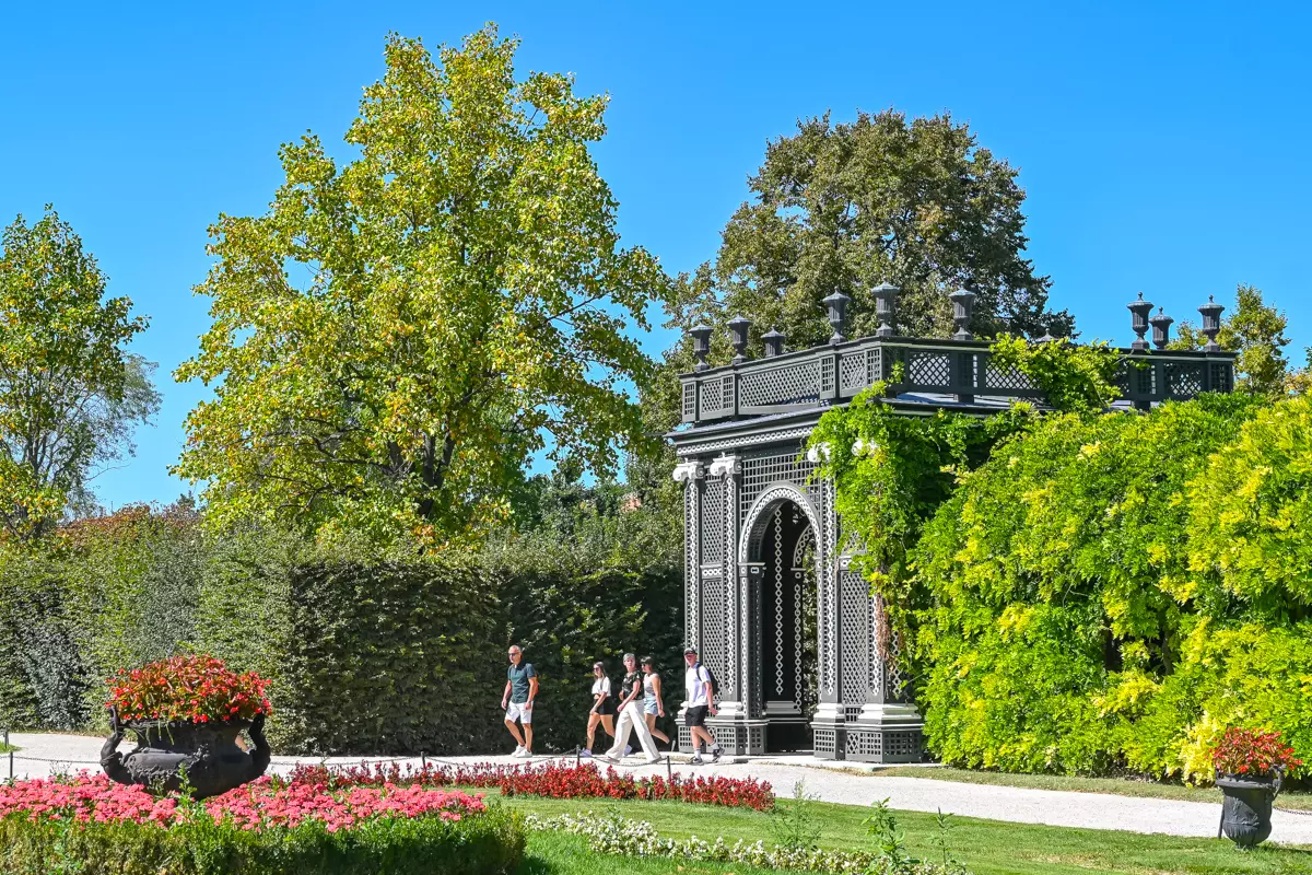 Schönbrunn Palace garden pavilion with visitors walking nearby