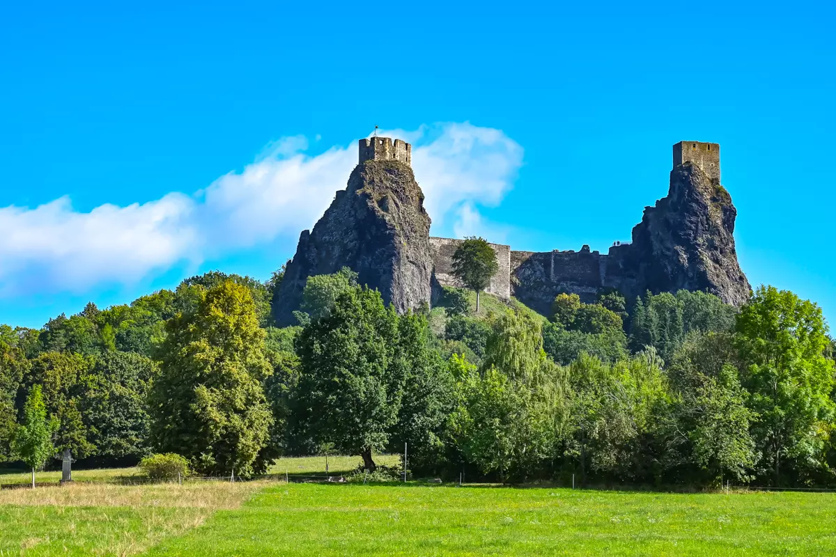 Trosky Castle towers seen from afar across the Bohemian countryside