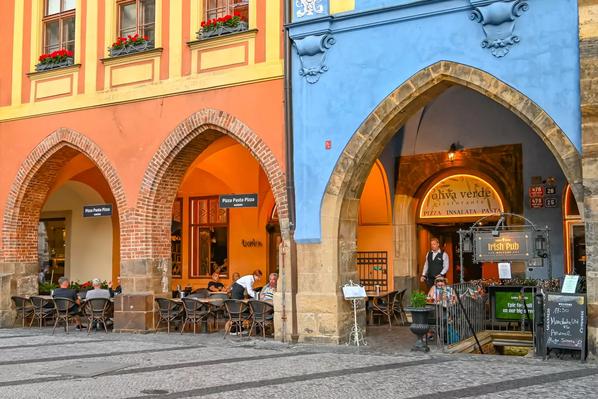 People sitting outdoors at a restaurant in Prague old town