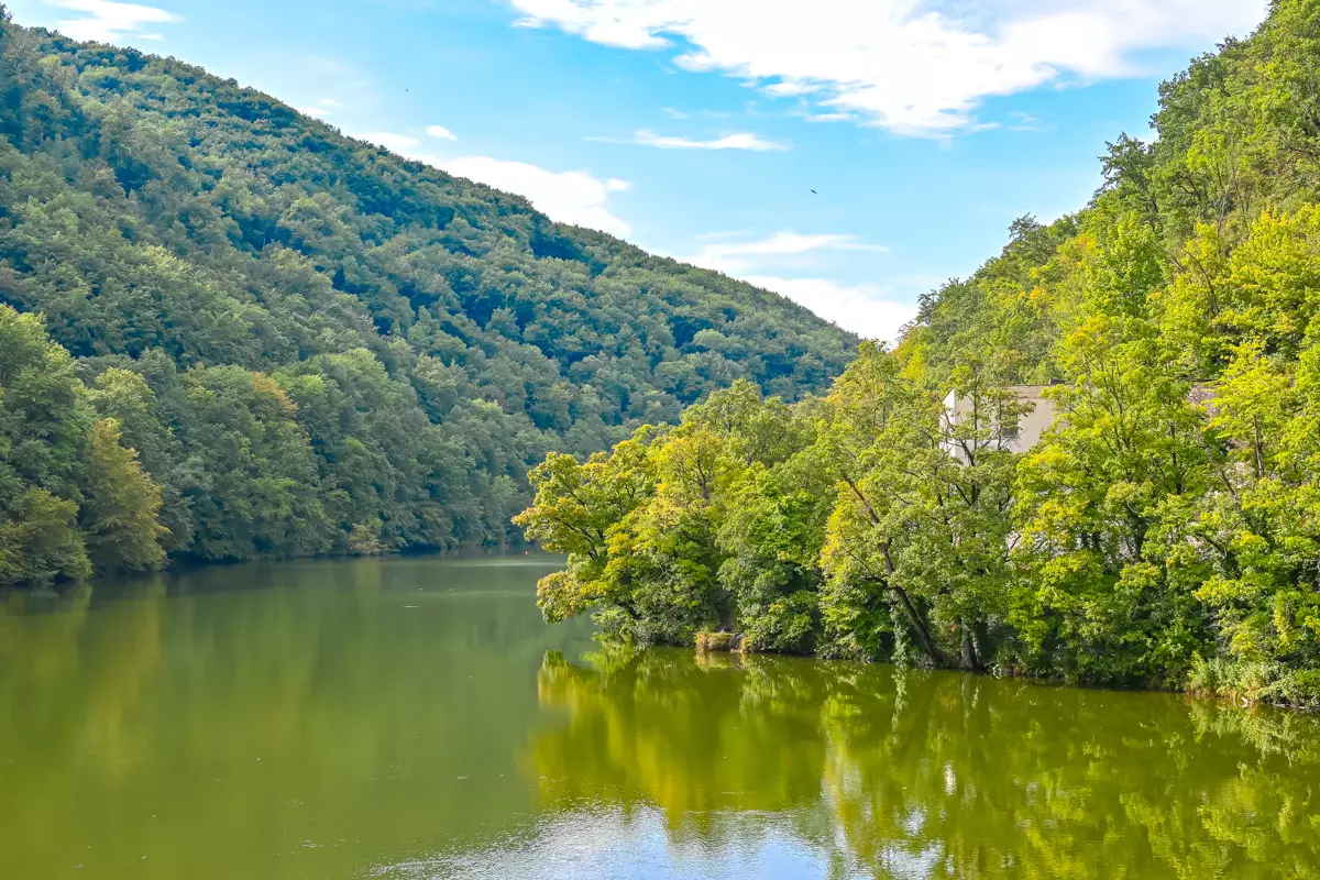 Lake Hámori in Lillafüred, surrounded by green forested hills.