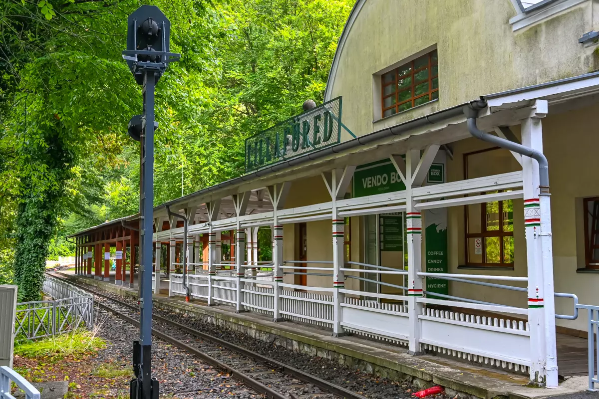 Lillafüred Train Station in Hungary surrounded by forested hills.
