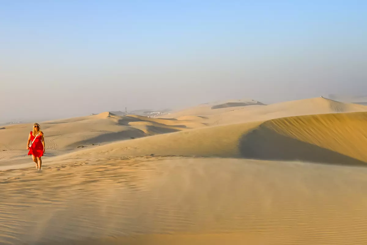 Golden desert dunes during a Doha desert safari at sunset